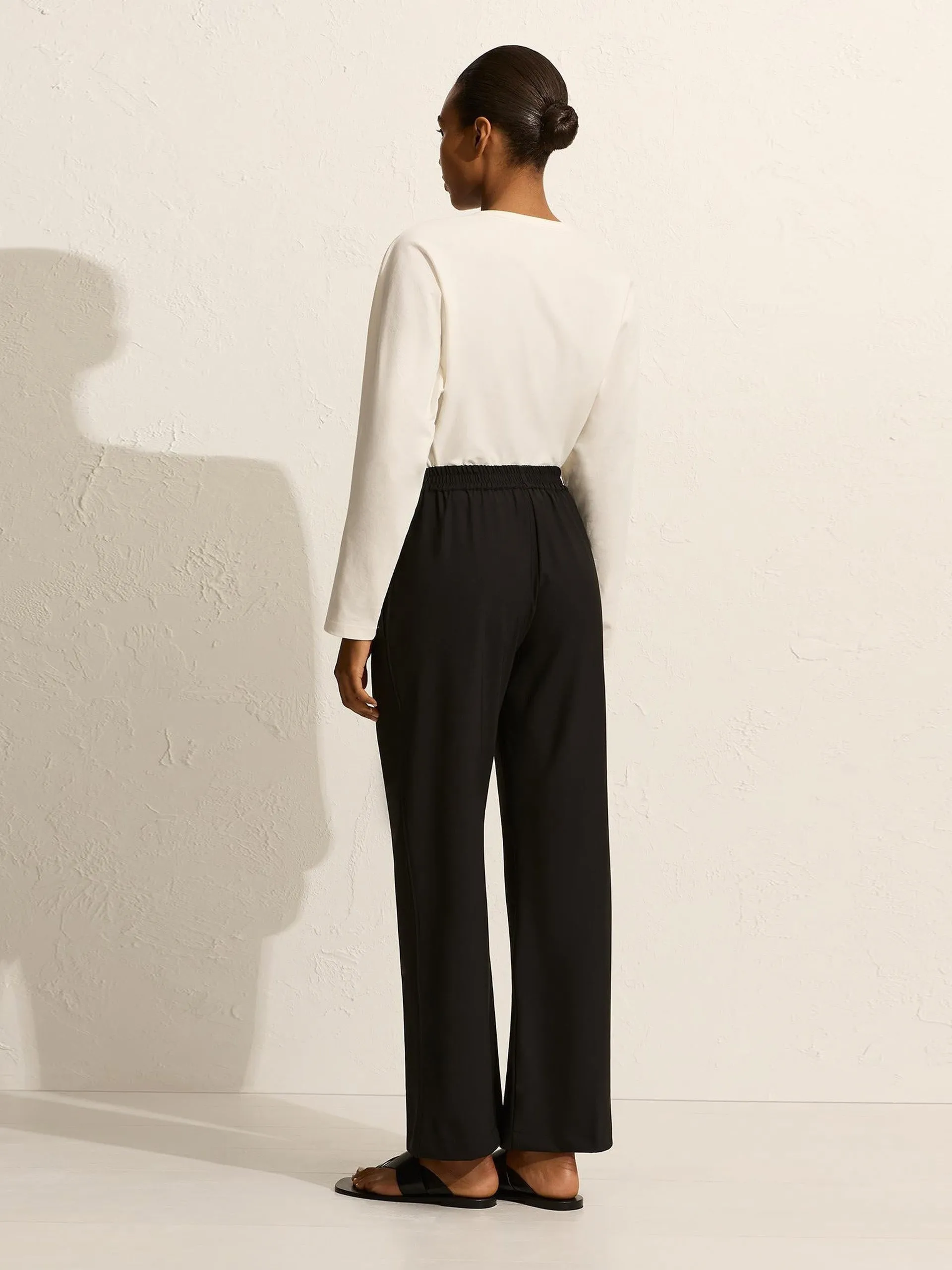 Black relaxed pin-stitch trousers