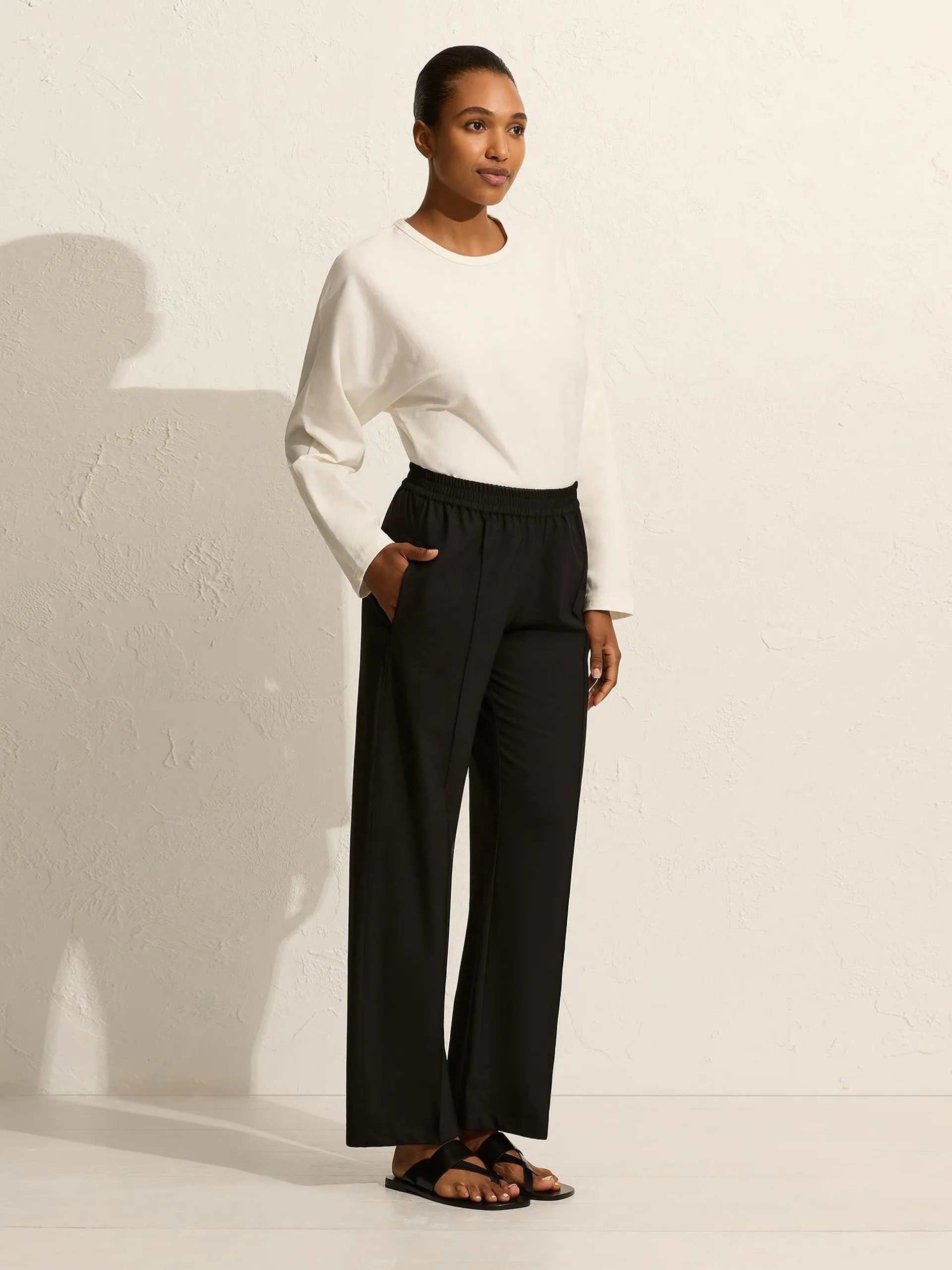 Black relaxed pin-stitch trousers