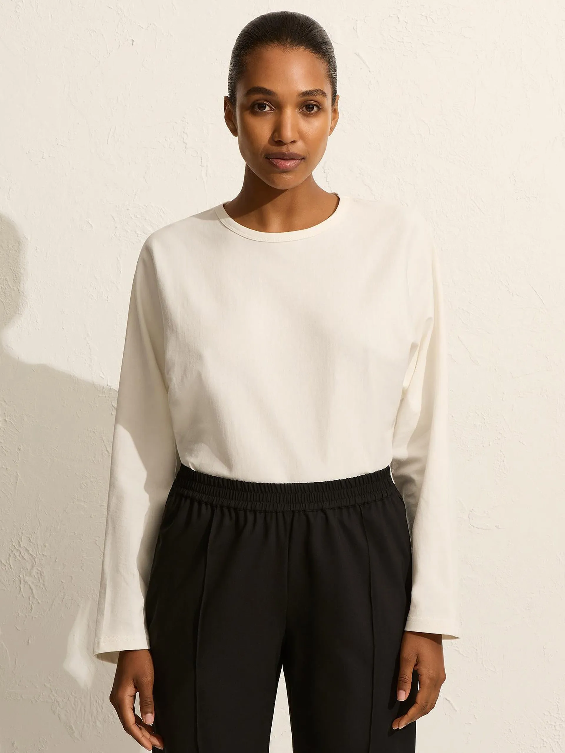Black relaxed pin-stitch trousers