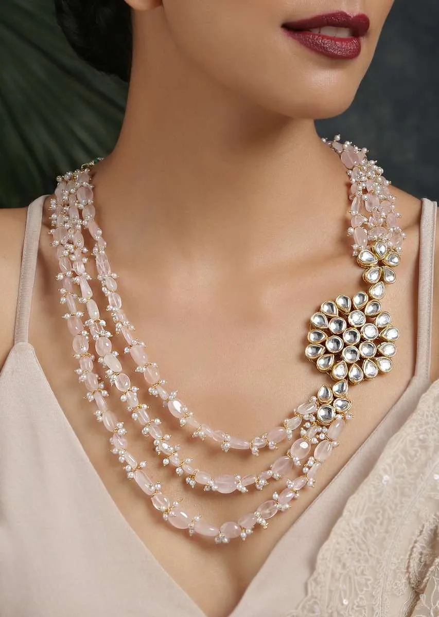 Gold Plated Layered Necklace Featuring Pastel Pink Stones And Moti Along With A Kundan Pendant On The Side By Paisley Pop