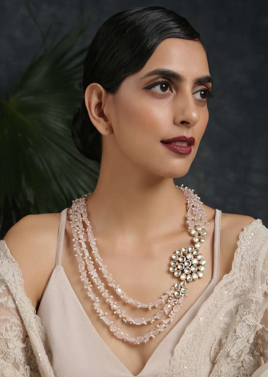 Gold Plated Layered Necklace Featuring Pastel Pink Stones And Moti Along With A Kundan Pendant On The Side By Paisley Pop