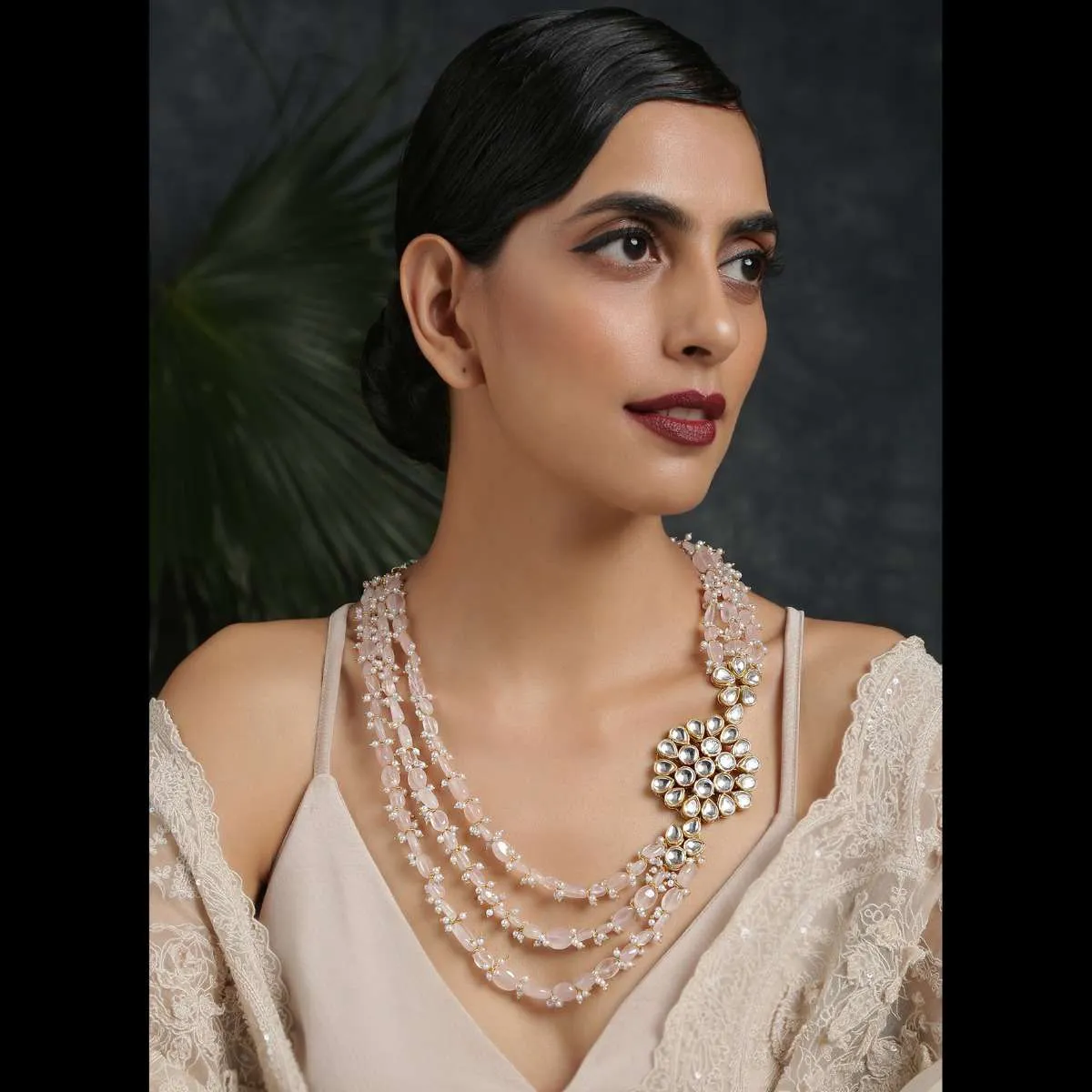 Gold Plated Layered Necklace Featuring Pastel Pink Stones And Moti Along With A Kundan Pendant On The Side By Paisley Pop